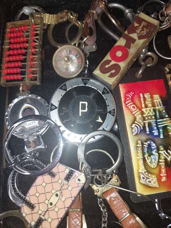 A bulk collection of erotica key rings sold  as is