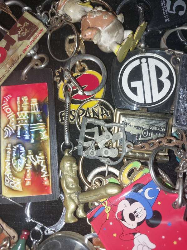 A bulk collection of erotica key rings sold  as is