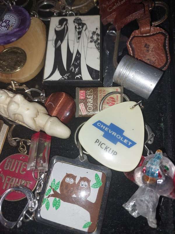 A bulk collection of erotica key rings sold  as is