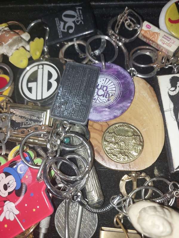 A bulk collection of erotica key rings sold  as is