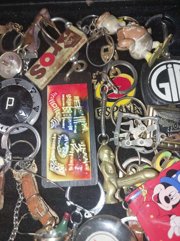 A bulk collection of erotica key rings sold  as is