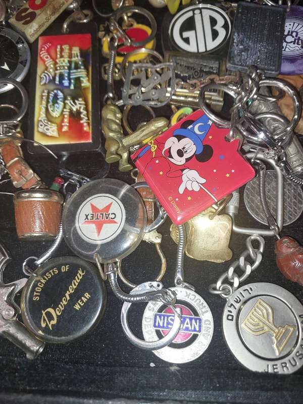 A bulk collection of erotica key rings sold  as is