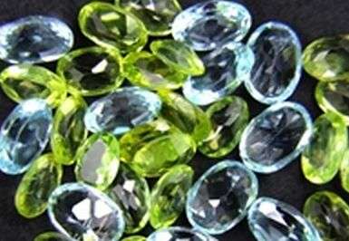 Mixed peridot and topaz 10 ct lot of ovals