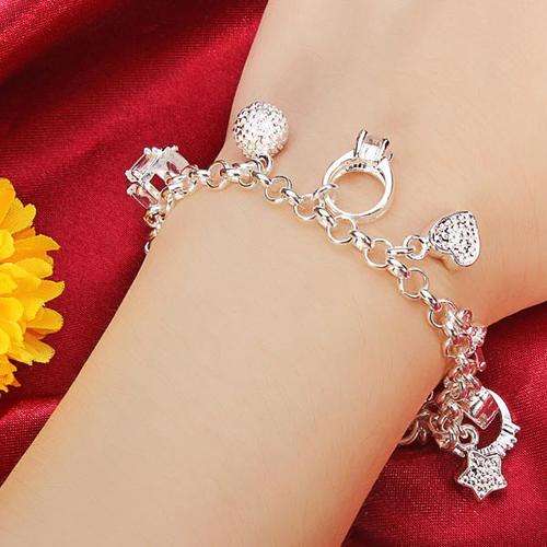 SPECIAL GIFT!!  IMPRESSIVE SILVER BRACELET WITH 13 CHARMS! SILVER NEVER BEFORE FOR R1-00!!!!