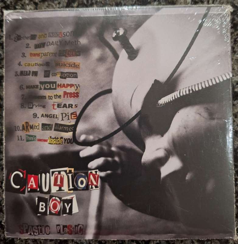 Caution Boy - Spastic Plastic