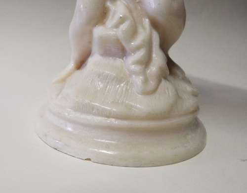 RESIN  statue of CHERUB HOLDING A FLOWER POT