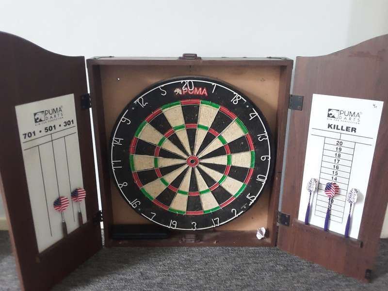PUMA DART BOARD COMES WITH WOODEN CASE THAT CAN BE WALL MOUNTED