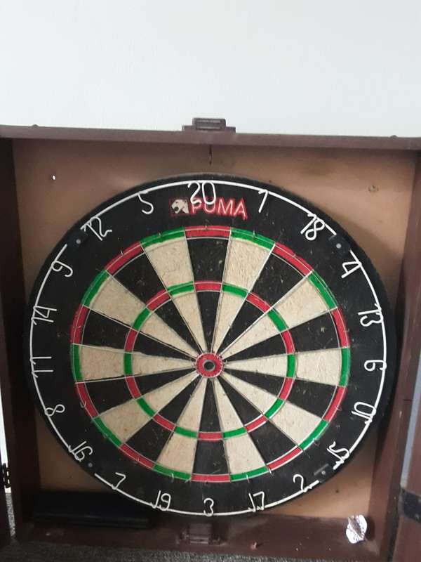 PUMA DART BOARD COMES WITH WOODEN CASE THAT CAN BE WALL MOUNTED