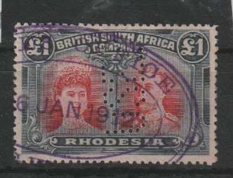 Rhodesia BSAC 1910 KGV Double Head perf 14 £1 car-red and bl-blk with gash in ear flaw fiscally used