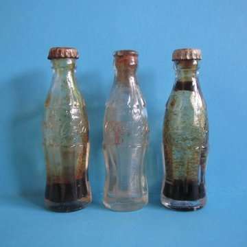 Coca-Cola 1950's Miniature Embossed Three Miniature Bottles.