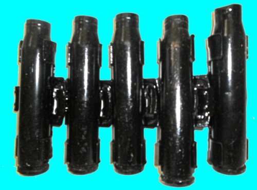 A Piece of Machine Gun Belt with Five 20 mm. Shell Casings.