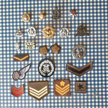 A Lot Of Military Badges.