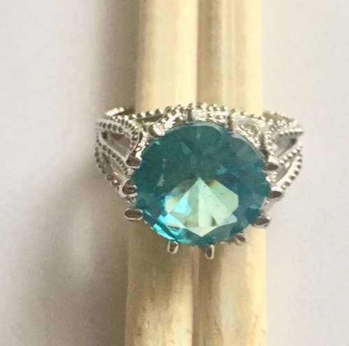 Flashing Sim Blue Topaz Set in 925 Sterling Silver Imported Filled Ring