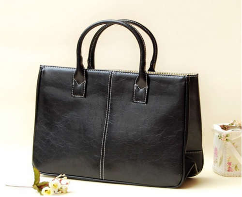 HIGHLY INDIVIDUAL  AND HIGH FASHION BLACK  HANDBAG
