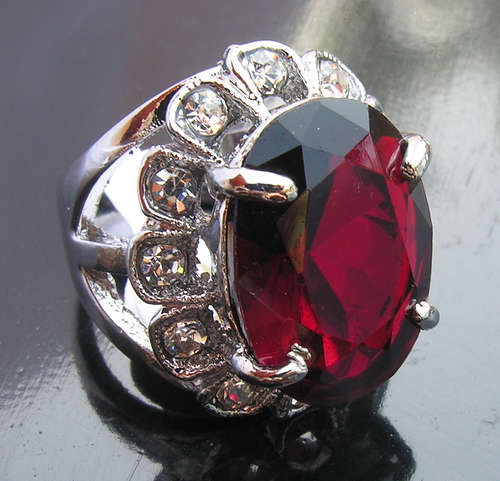 Magnificent 18KGP Dress Ring with Huge Oval Red Stone.