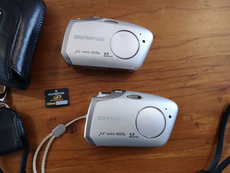 Two Olympus mju-mini digital compact cameras