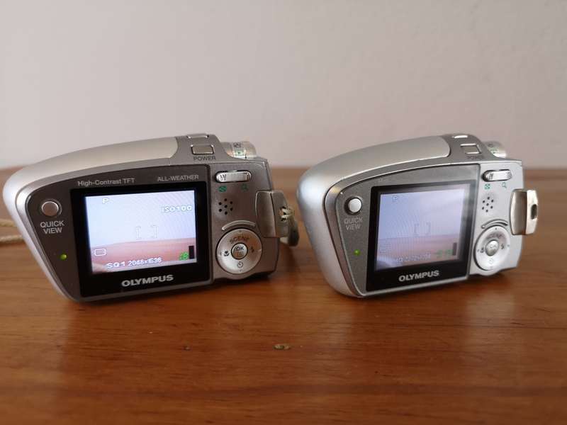 Two Olympus mju-mini digital compact cameras