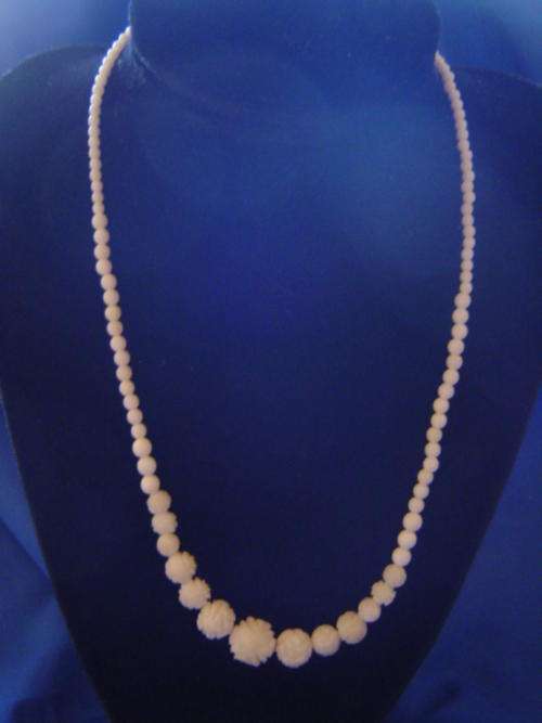 Magnificant hand carved flower balls Ivory neclace with Ivory scew clip Vintage