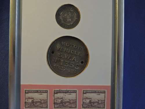Framed ZAR 1895 2 Shillings Coin with 1927 SWA Motor Vehicle License disk / Token and Train Stamps