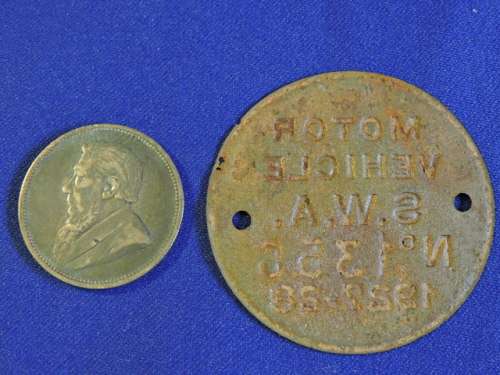 Framed ZAR 1895 2 Shillings Coin with 1927 SWA Motor Vehicle License disk / Token and Train Stamps