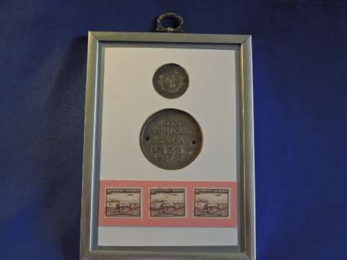 Framed ZAR 1895 2 Shillings Coin with 1927 SWA Motor Vehicle License disk / Token and Train Stamps