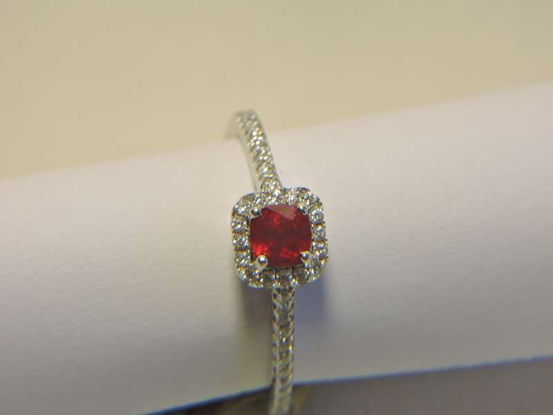 Sterling Silver Ruby & Zirconia (red stone) ring.