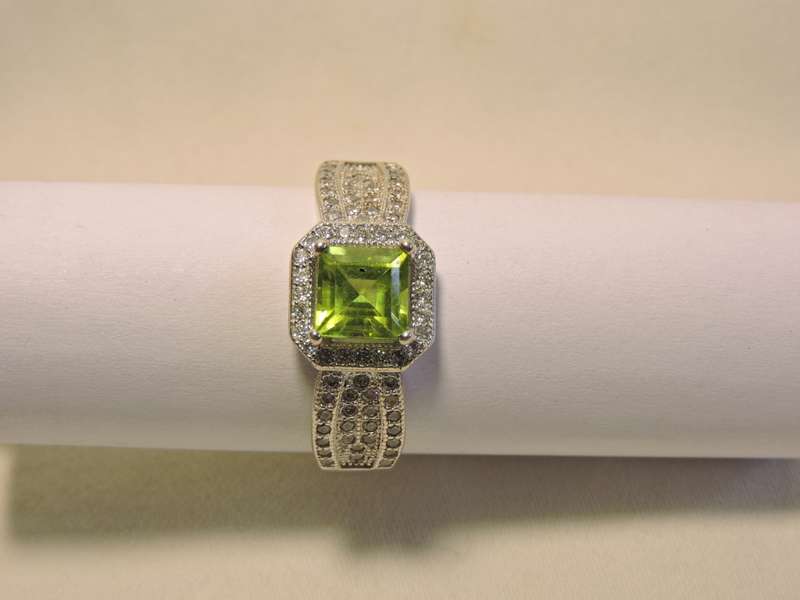 Sterling Silver, Peridot & Zirconia (green stone) ring.