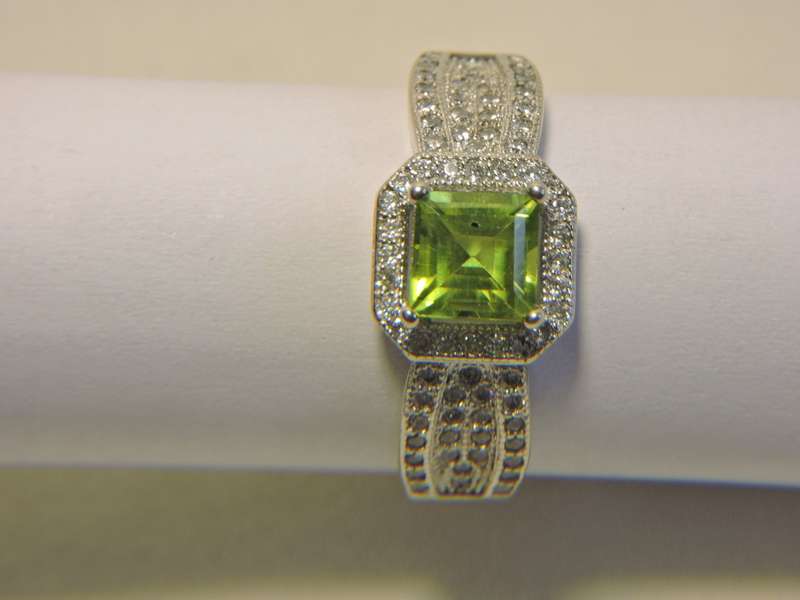 Sterling Silver, Peridot & Zirconia (green stone) ring.