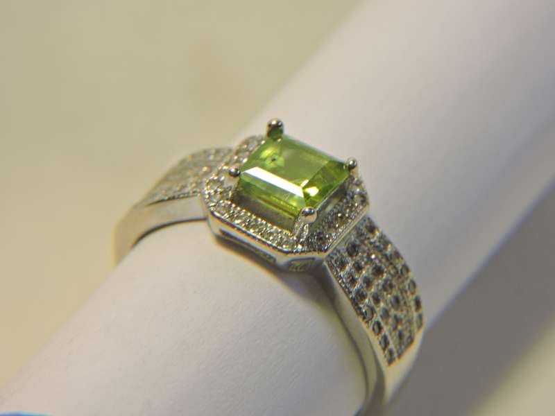 Sterling Silver, Peridot & Zirconia (green stone) ring.