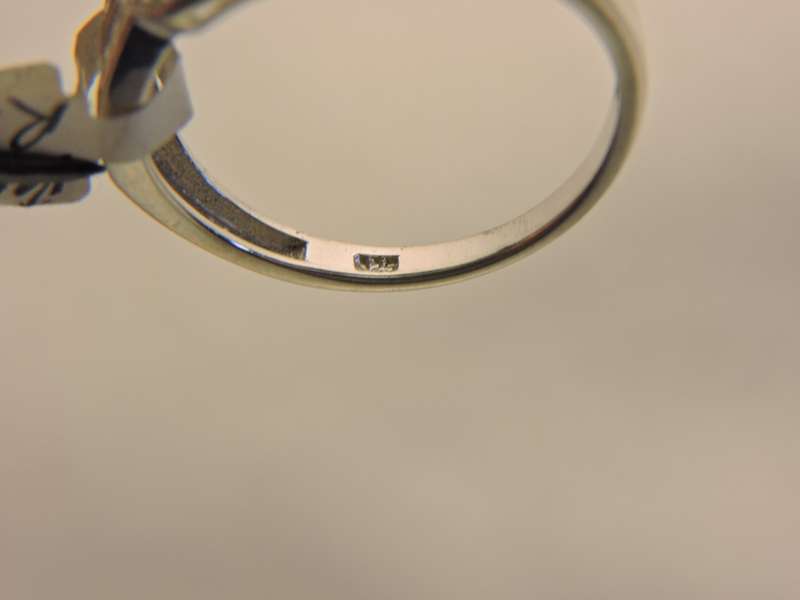 Sterling Silver, Peridot & Zirconia (green stone) ring.