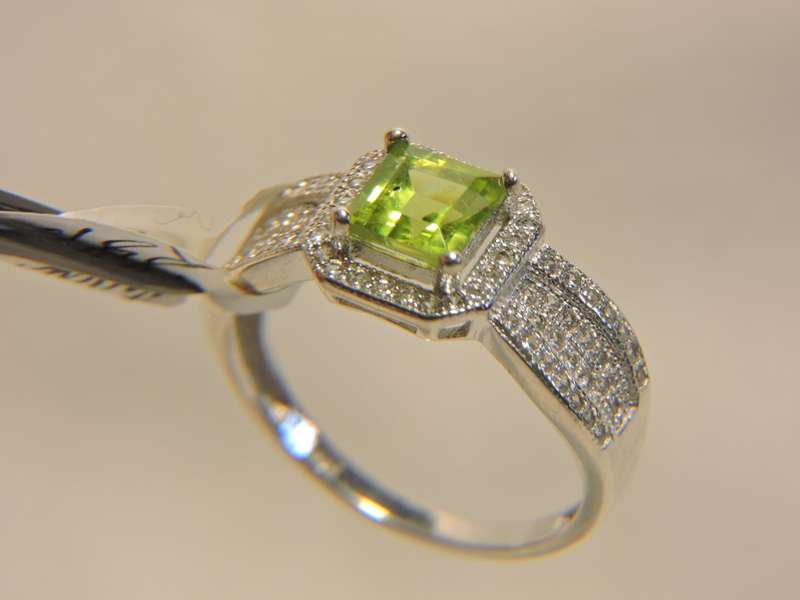 Sterling Silver, Peridot & Zirconia (green stone) ring.