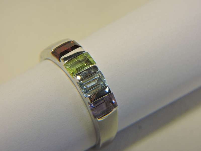 Sterling Silver & Multi-colour stone  ring. ( possibly Topaz, Amethyst, Peridot & Garnet)