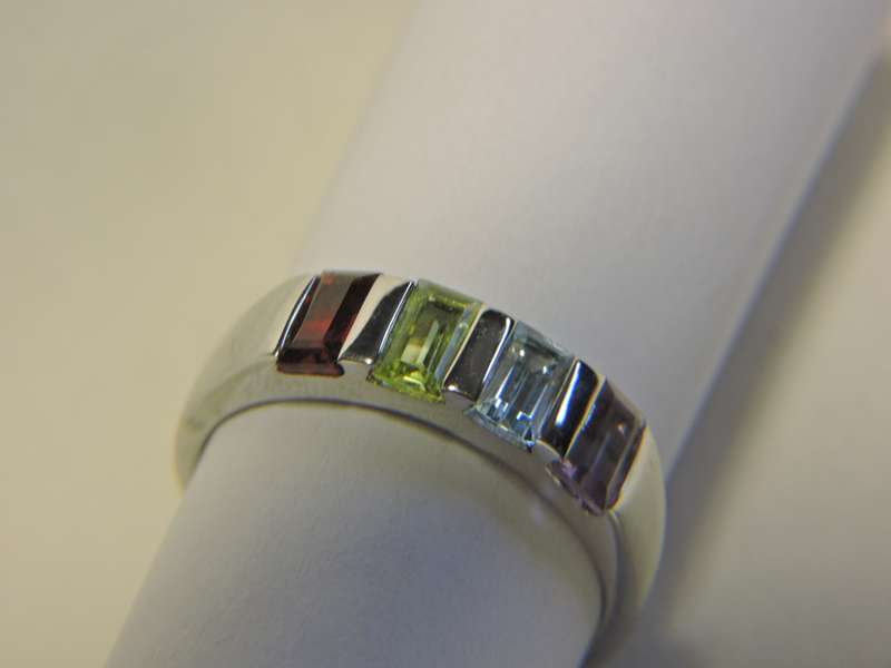 Sterling Silver & Multi-colour stone  ring. ( possibly Topaz, Amethyst, Peridot & Garnet)