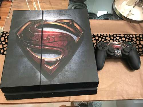 PlayStation 4 with 4 games and 1 controller.