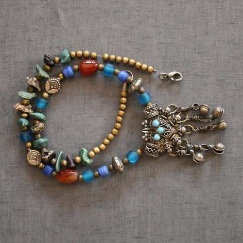 Exotic pewter pendant on a beaded necklace