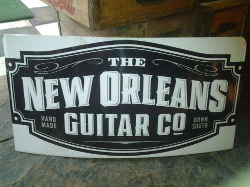 new orleans guitar company advertising metal sign