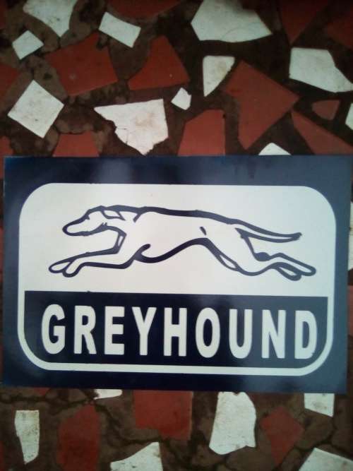 greyhound metal sign