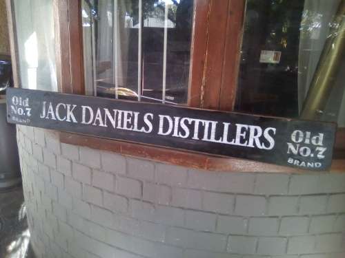 jack daniels distillers wooden painted sign