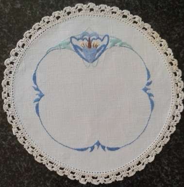 Two vintage linen embroidered doilies