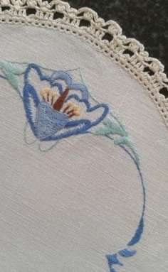 Two vintage linen embroidered doilies
