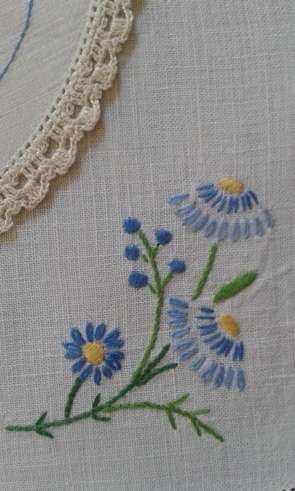 Two vintage linen embroidered doilies