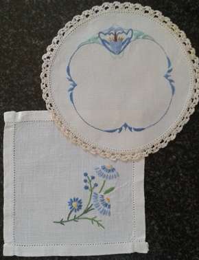 Two vintage linen embroidered doilies