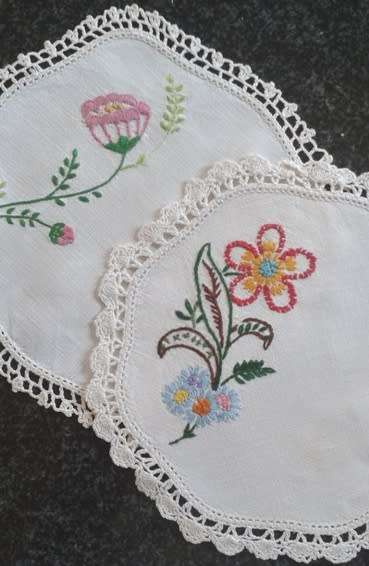 Two lovely vintage embroidered linen doilies 20cm square