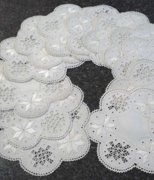 Two dozen round vintage linen Lefkara lace doilies/table mats