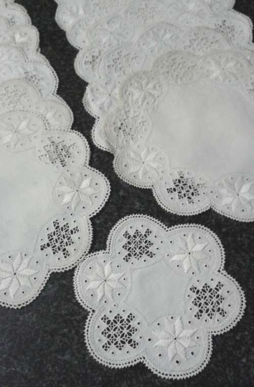 Two dozen round vintage linen Lefkara lace doilies/table mats