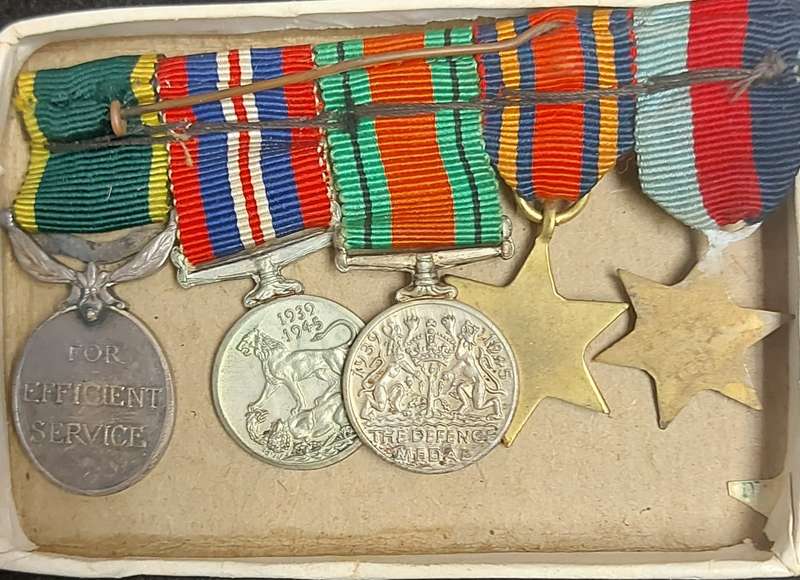 A SET OF MINIATURE WW2 MEDALS FOR CAPTAIN LC CROSS