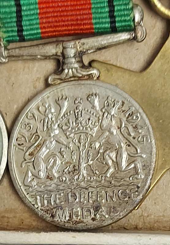 A SET OF MINIATURE WW2 MEDALS FOR CAPTAIN LC CROSS