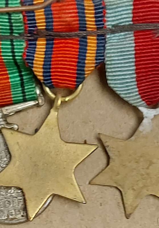 A SET OF MINIATURE WW2 MEDALS FOR CAPTAIN LC CROSS
