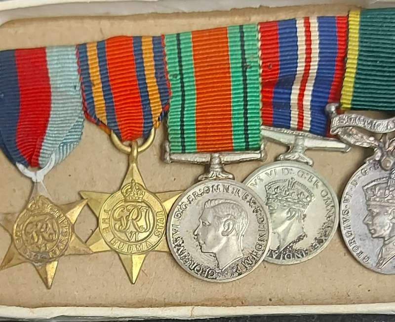 A SET OF MINIATURE WW2 MEDALS FOR CAPTAIN LC CROSS