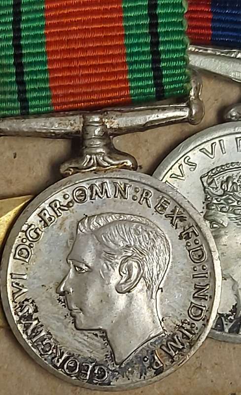A SET OF MINIATURE WW2 MEDALS FOR CAPTAIN LC CROSS